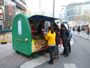 Commuters grabbing breakfast on their way to work in Beijing